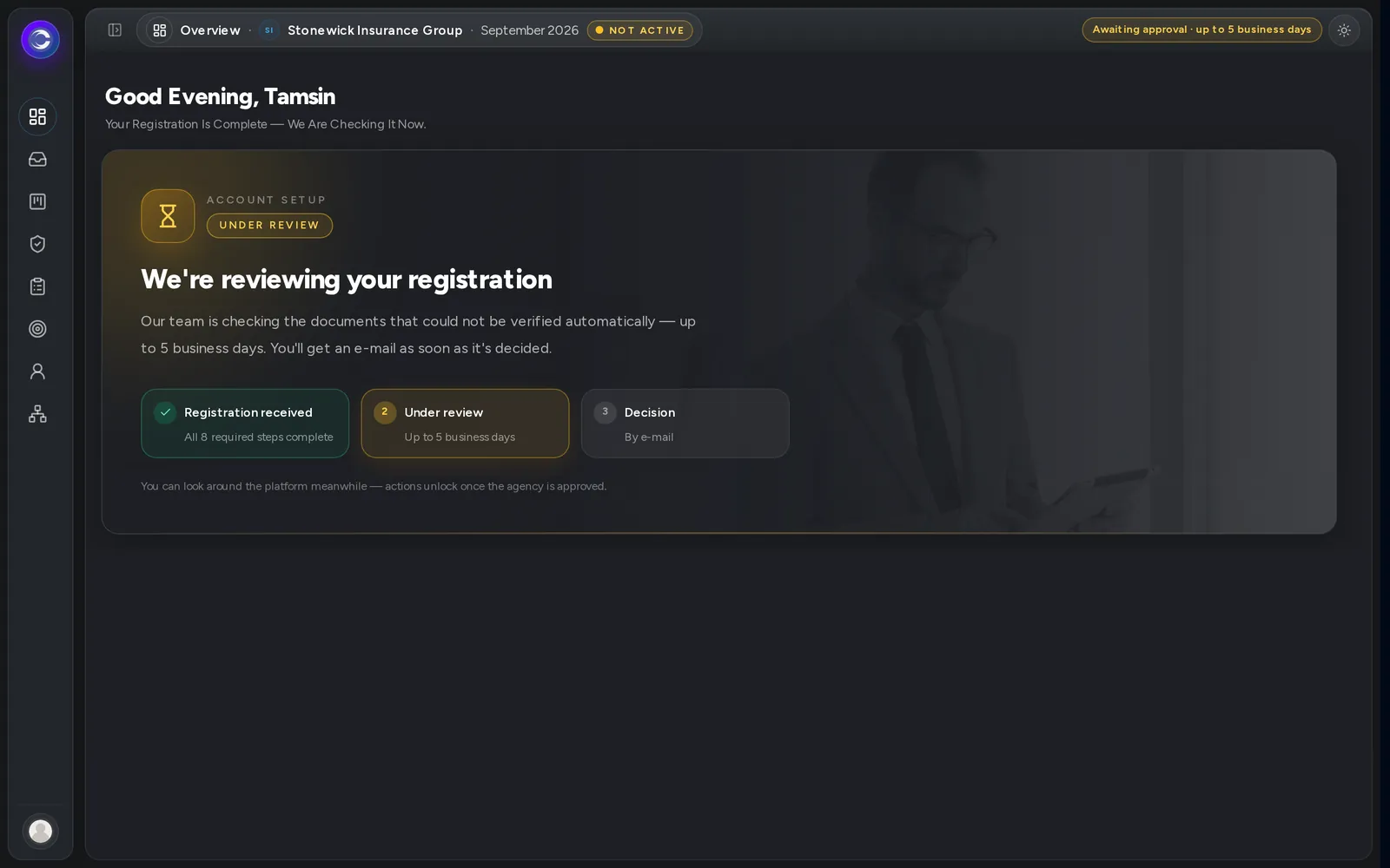 A screen reading We're reviewing your registration.